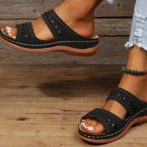 Black Sandals with Perforated Straps and Elevated Sole